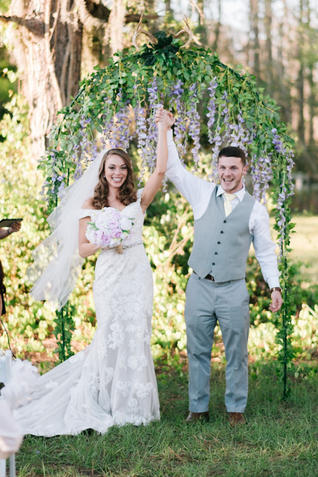 Outdoor Farm Wrought Iron Wedding Ceremony Arch with Hanging Purple Lilac Floral and Greenery | Tampa Bay Rustic Chic Private Home Estate Wedding Venue Southern Plantation Oasis