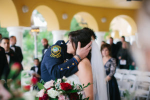 Outdoor Wedding Ceremony Portrait with Pink, Ivory, and Red Rose Bouquet with Greenery and Police Officer Groomsmen in Uniform | Venue Tampa Palms Golf and Country Club | Event Planner Parties A La Carte