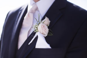 Outdoor Groom Portrait in Navy Blue Vera Wang Suit with Blush PInk Tie, White Pocket Square, and Rose with Baby's Breath and Greenery Ribbon Wrapped Boutonniere | Siesta Key Wedding PHotographer Djamel PHotography