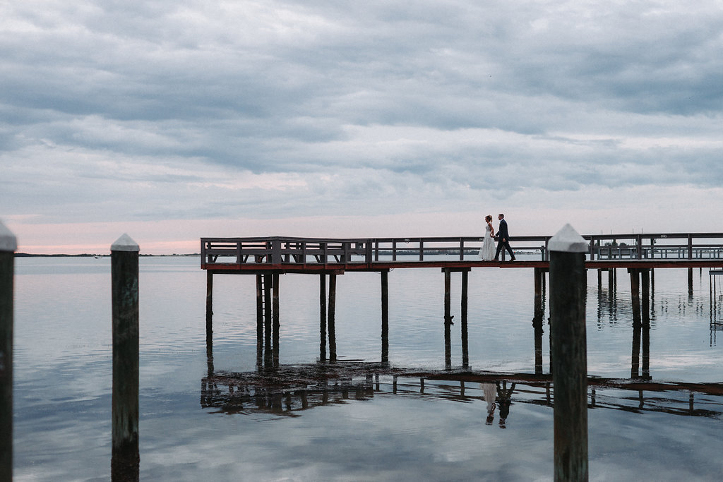 Creative Outdoor Waterfront Wedding Portrait on Dock | Tampa Bay Wedding Photographer Grind and Press Photography | Dunedin Venue Beso Del Sol