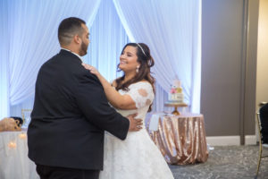 Bride and Groom First Dance Portrait, Bride in Lace Sleeve Pronovias Ballgown Dress with Pearl Headband, Rose Gold Sequin Table Linen and White Draping Decor | Tampa Bay Wedding Venue Tampa Palms Golf and Country Club