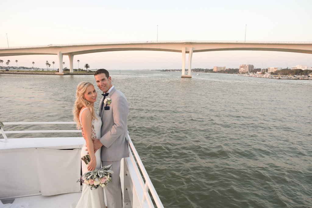 Outdoor Waterfront Wedding Portrait, Groom in Grey Linen Suit, Bride with Blush Pink and White Rose with Blue Berries and Greenery Bouquet | Clearwater Beach Unique Wedding Venue Yacht Starship | Photographer Lifelong Photography Studios