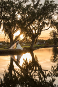 Outdoor Creative Rustic Romantic Southern Barn Wedding Portrait Under Oak Trees | Tampa Bay Rustic Wedding Venue Wishing Well Barn