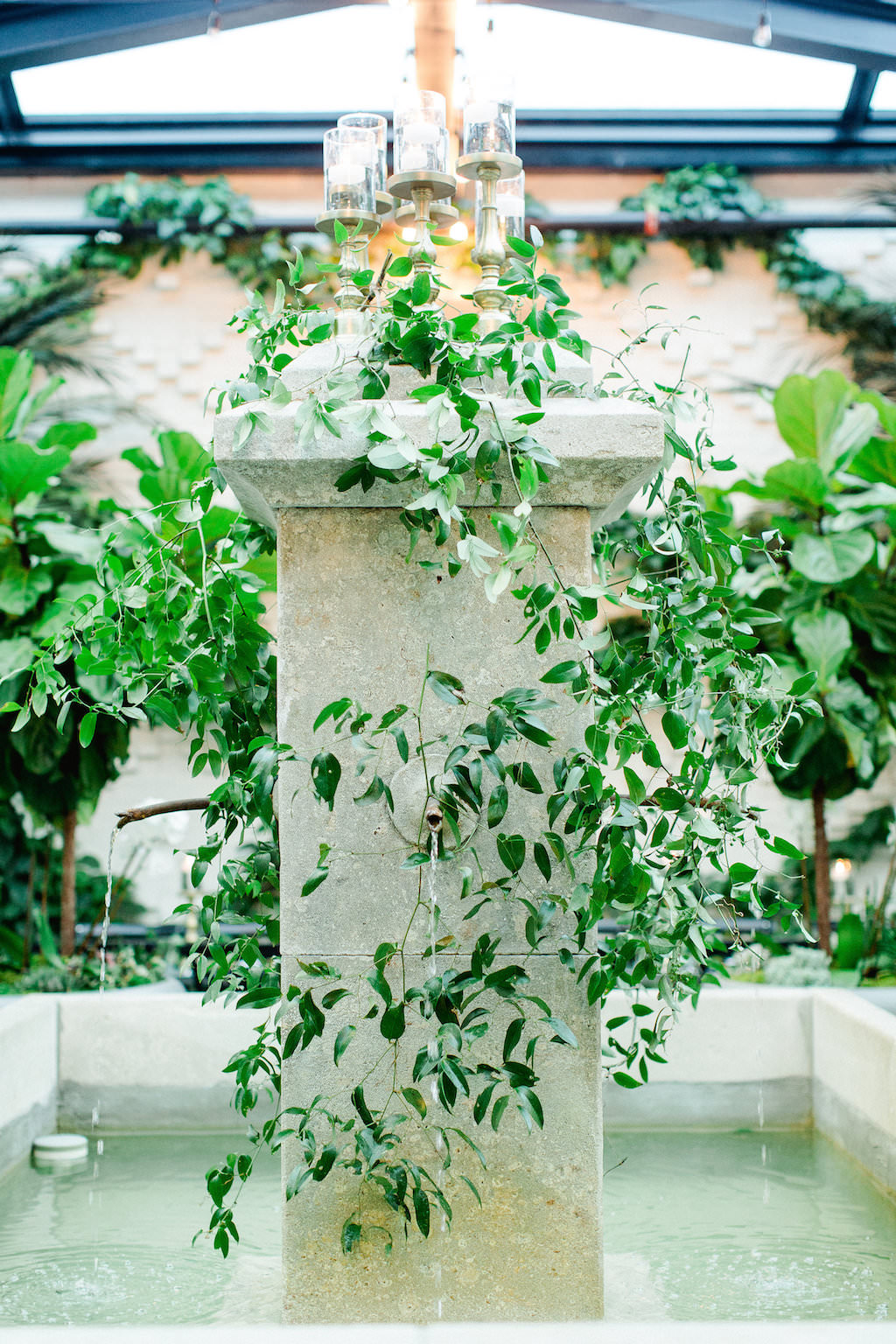 Atrium Wedding Reception Fountain with Greenery at Downtown Tampa Historic Wedding Venue The Oxford Exchange