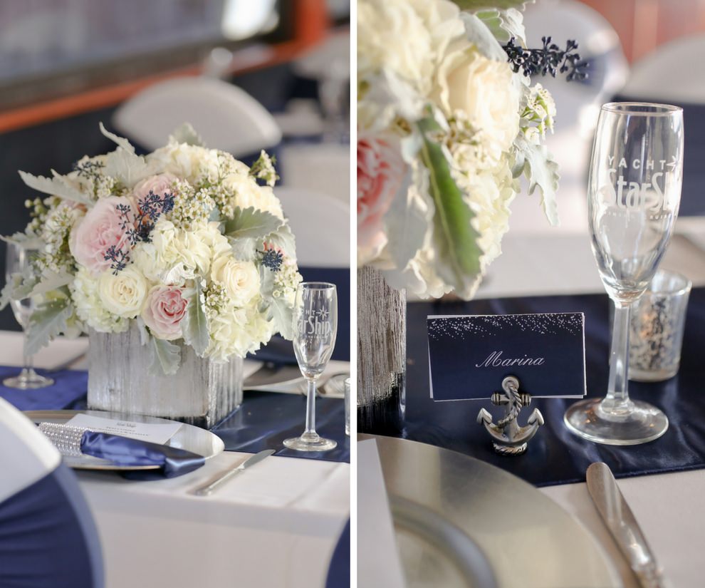 Nautical Wedding Reception Table Setting with Blush Pink and White Roses, Blue Berries and Greenery Low Centerpiece in Wooden Box, with Silver Charger, Navy Blue Linens and Satin Runner, Rhinestone Napkin Ring and Silver Charger, White Printed on Blue Place Card with Anchor Holder | Tampa Bay Wedding Venue Yacht Starship