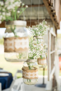 Rustic Barn Wedding Decor with Lace and Burlap Hanging Mason Jar with Baby's Breath Floral | Tampa Bay Barn Wedding Venue Wishing Well Barn