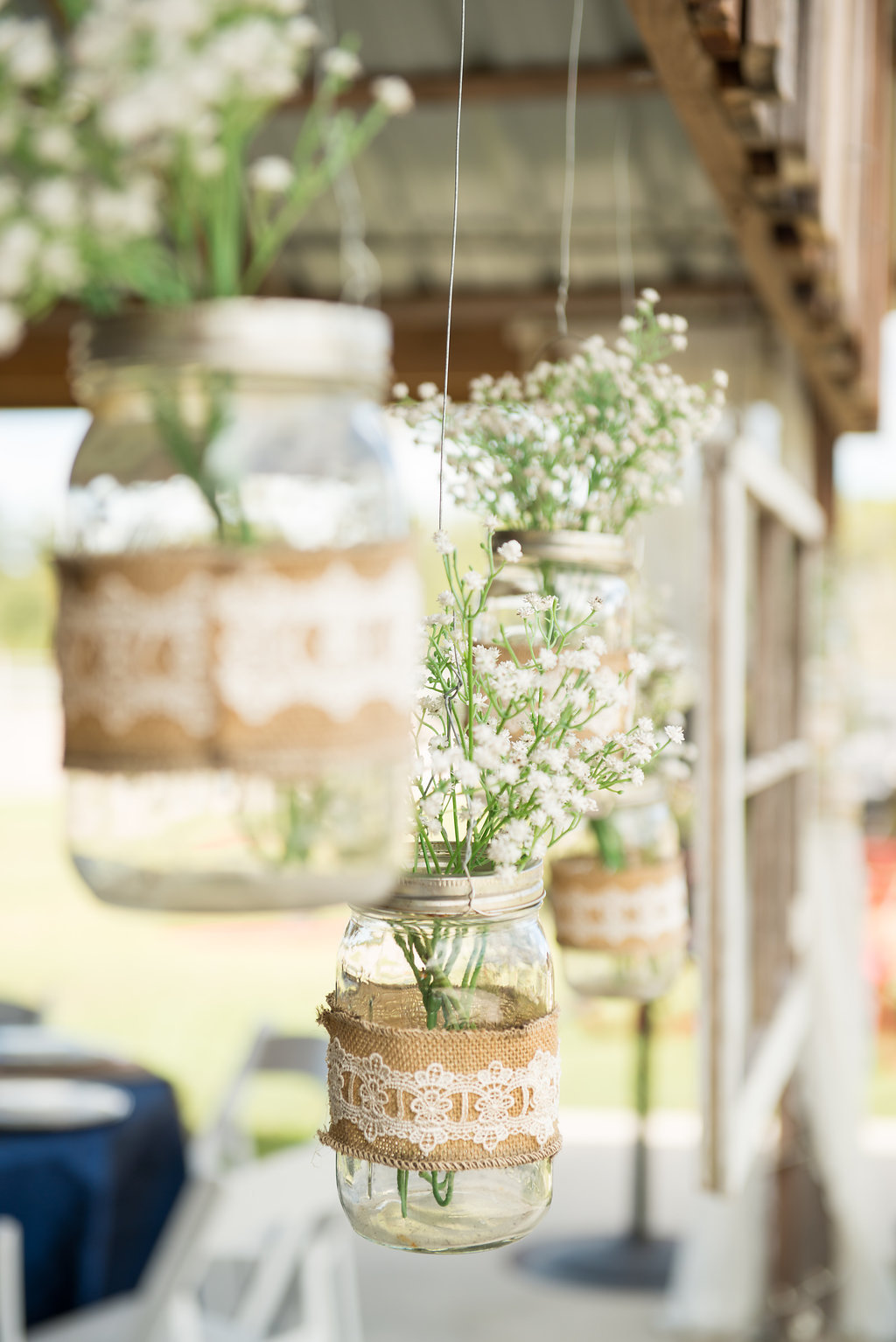 Rustic Barn Wedding Decor with Lace and Burlap Hanging Mason Jar with Baby's Breath Floral | Tampa Bay Barn Wedding Venue Wishing Well Barn