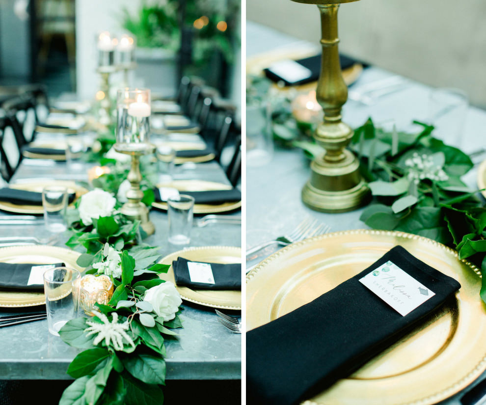 Stylish Intimate Atrium Wedding Reception, with Long Metal Feasting Tables with Greenery Garland Centerpiece, Black Crossback Chairs, Gold Chargers and Black LInens | Downtown Tampa Historic Wedding Venue The Oxford Exchange