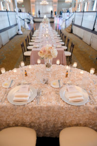 Hotel Ballroom Pink and Champagne Wedding Reception Sweetheart Table with Low Ivory and Pink Rose Centerpiece, Floating Votive Candles in Glass Holders, Black Chiavari Chairs | Textured Linen Rentals from Kate Ryan Linens | Historic Waterfront Hotel Wedding Venue The Don CeSar