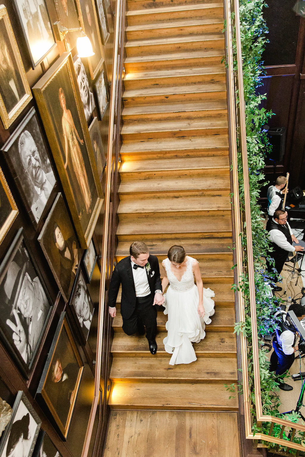 Indoor Wedding Portrait on Staircase, Bride in V Neck Lace Hayley Paige Dress, Groom in Black Tuxedo | Tampa Wedding Photographer Ailyn La Torre Photography | Downtown Historic Venue The Oxford Exchange