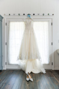David's Bridal Ballgown Lace WEdding Dress On Hanger with Silver Pointed Wedding Shoes