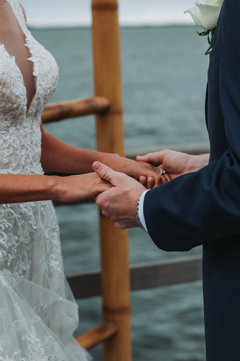 Outdoor Waterfront Wedding Ceremony Portrait, Groom in Blue Suit with White Rose Boutonniere | Tampa Bay Wedding Photographer Grind and Press Photography