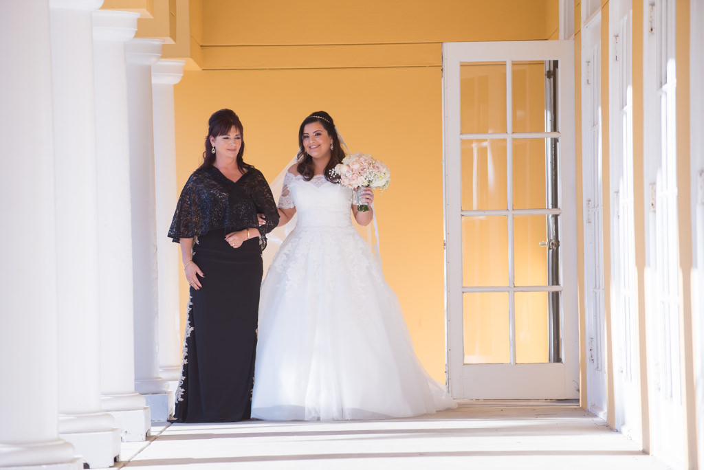Outdoor Wedding Ceremony Portrait, Bride in Ballgown Off the Shoulder Pronovias Dress with Pink and White Floral Bouquet, Mother of the Bride in Black Dress with Lace Cape | Wedding Venue Tampa Palms Golf and Country Club