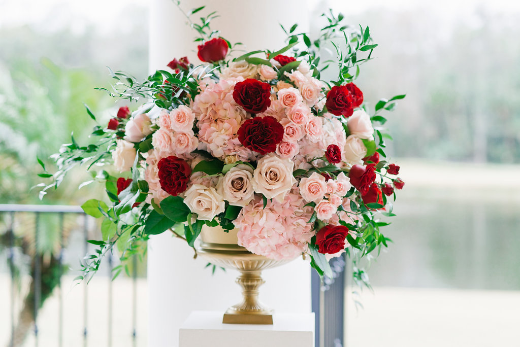 Ivory, Pink, and Red Rose Florals in Classic Gold Vase on Pedestal Ceremony Florals | Tampa Bay Planner Parties A La Carte