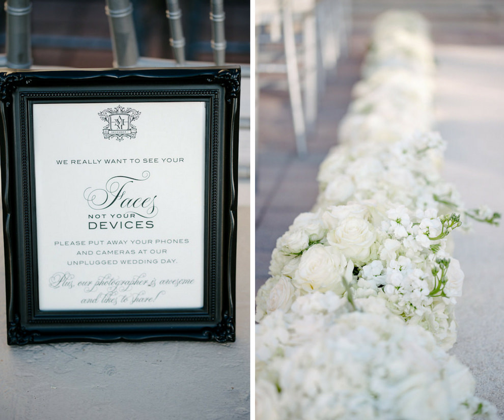 Elegant Printed Unplugged Ceremony Sign with Custom Monogram in Dark Blue Printed on White in Black Frame, with Silver Chiavari Chairs and White Floral lined Wedding Ceremony Aisle | Tampa Bay Wedding Stationery and Paper Goods URBANcoast