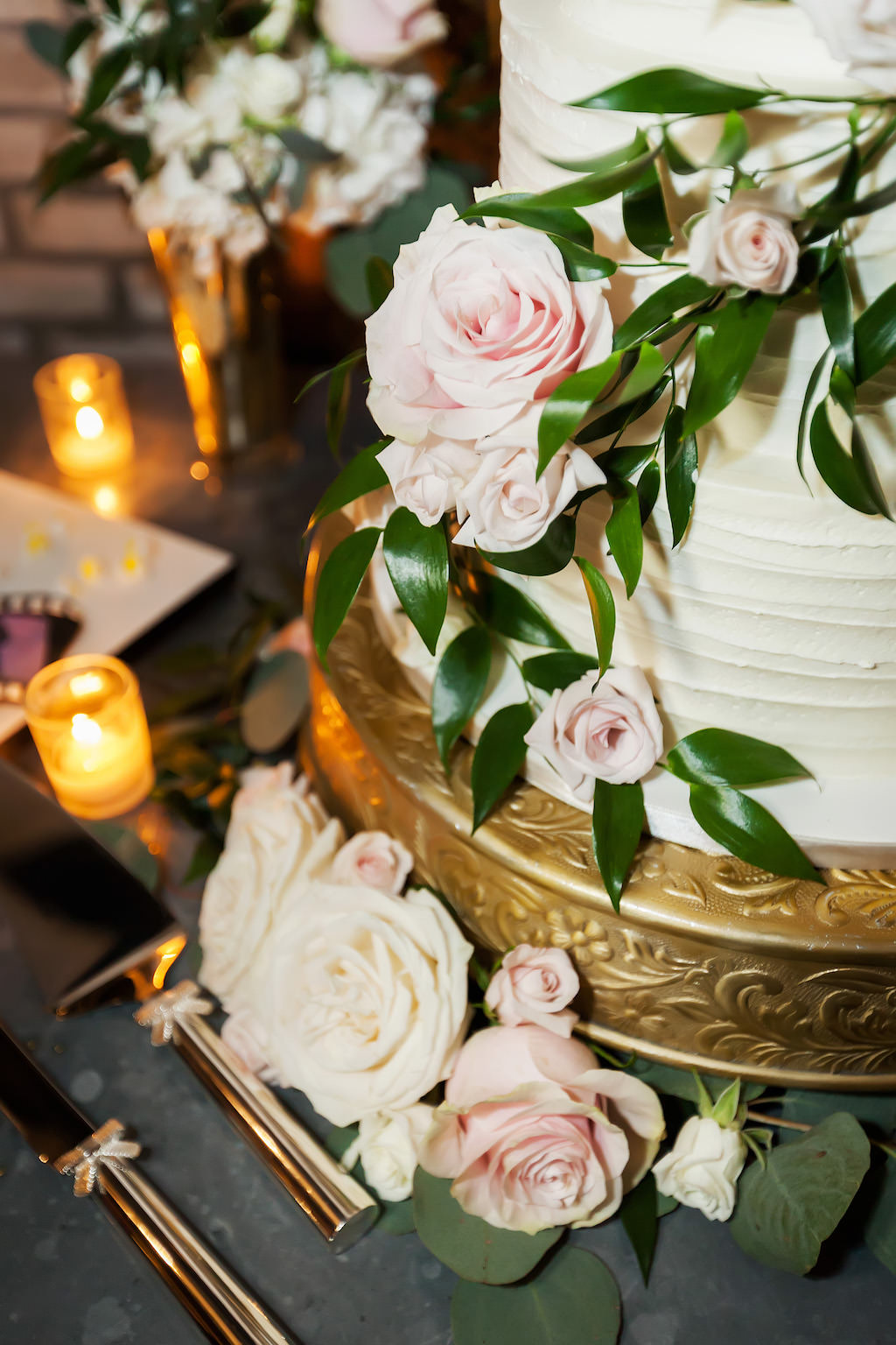 Round White Wedding Cake with Pink Rose and Greenery on Gold Cake Stand