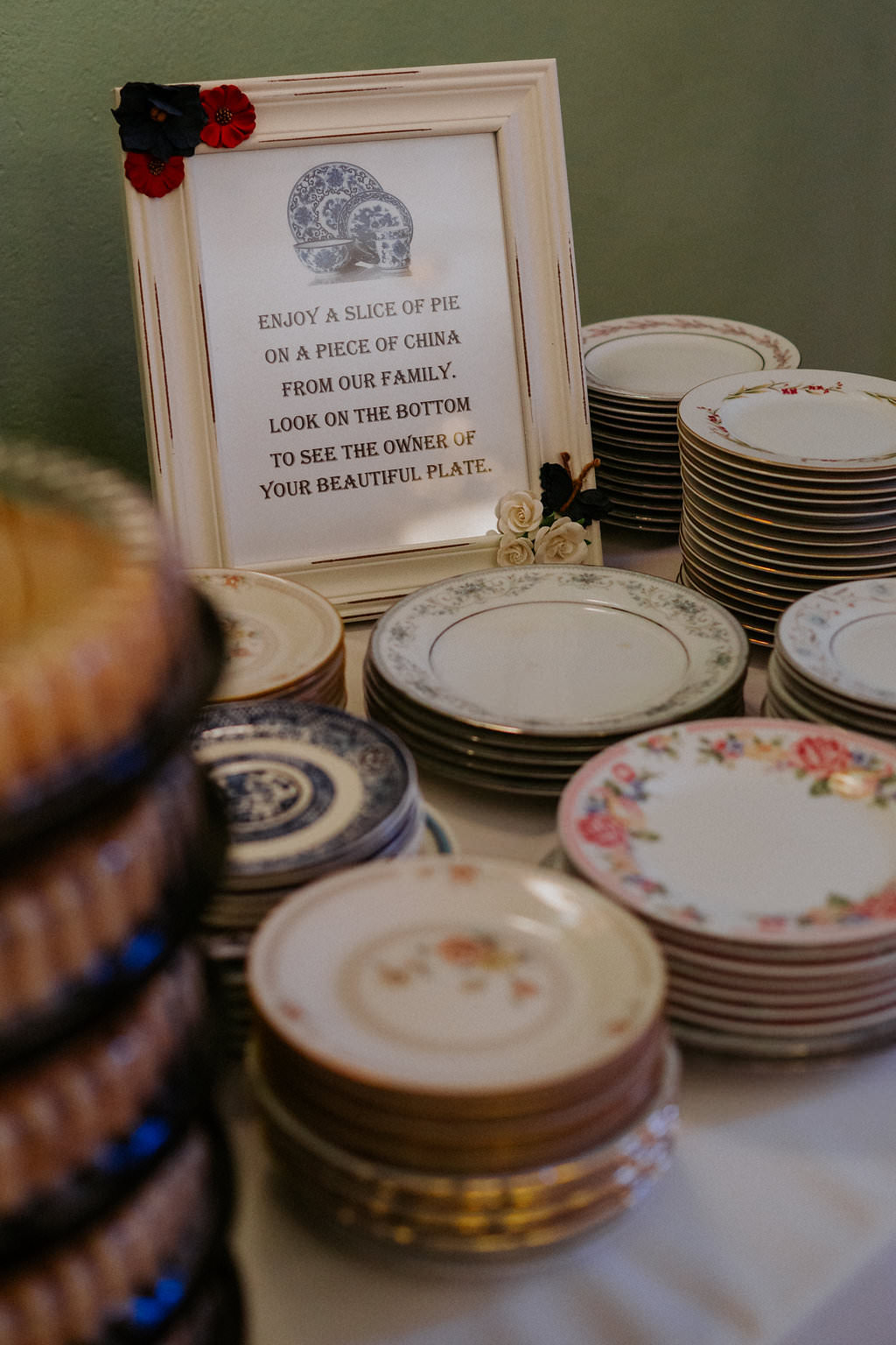 Wedding Dessert Table with Vintage Mismatched Porcelain China Plates and Printed Sign with Red White and Blue Floral Painted Frame, and Pies | Tampa Bay Wedding Planner Special Moments Event Planning