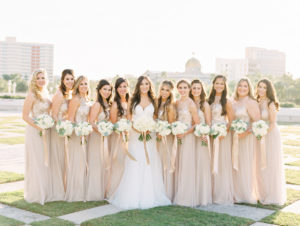 Outdoor Downtown Tampa Park Bridal Party Wedding Portrait, Bridesmaids in Floral Lace Illusion Halter Champagne Amsale Dresses, with White Floral and Greenery Bouquet with Champagne Ribbon, Bride in Princess Neckline Tatiana Martina Dress | Tampa Dress Shop Bella Bridesmaids