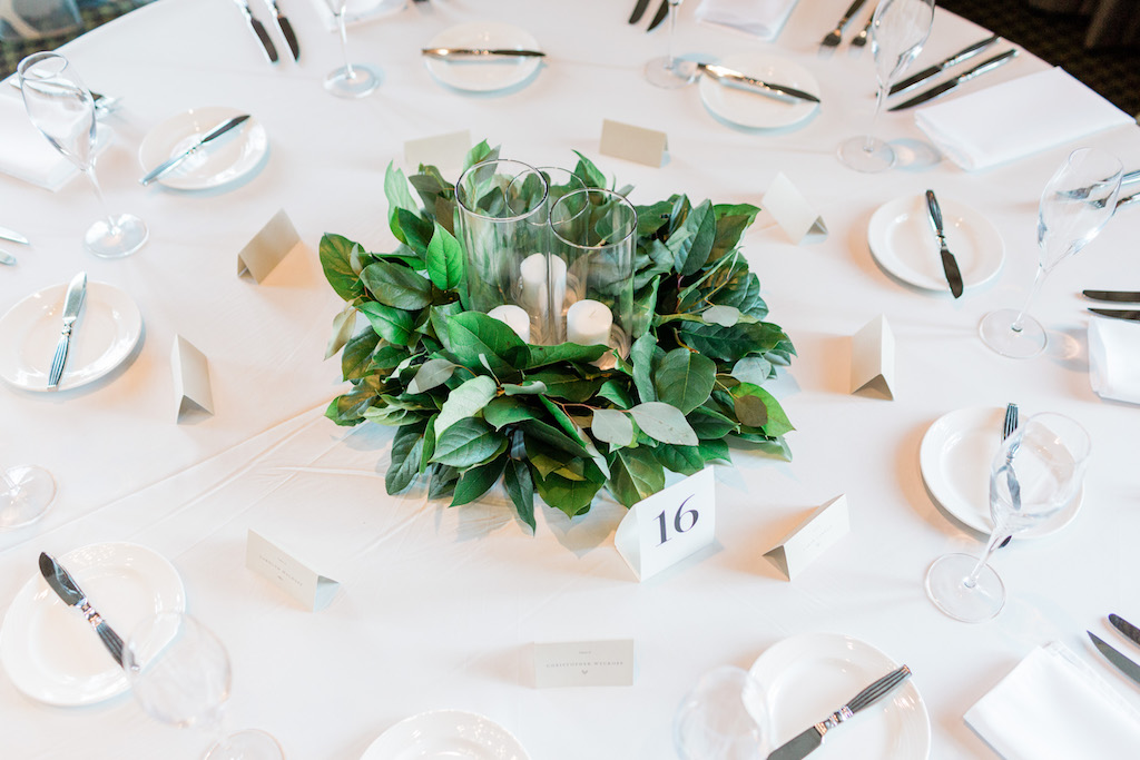 Elegant Ivory White and Taupe Wedding Reception Round Table with Low Greenery Centerpiece with Small Pillar Candles in Glass Vases, Elegant Printed Table Number and Place Cards | St Petersburg Wedding Florist Cotton and Magnolia