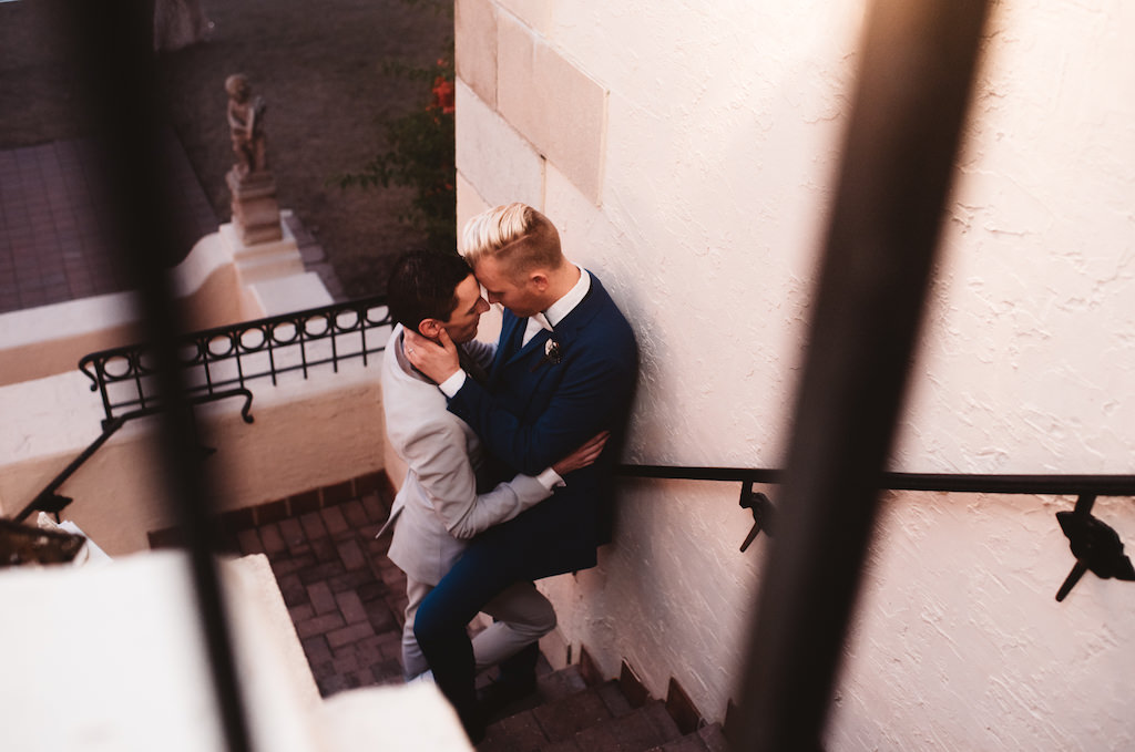 Same Sex Gay Wedding Creative Candid Wedding Portrait, Groom in Light Gray and Royal Blue Tuxedo | Historic Sarasota Wedding Venue Powel Crosley Estate