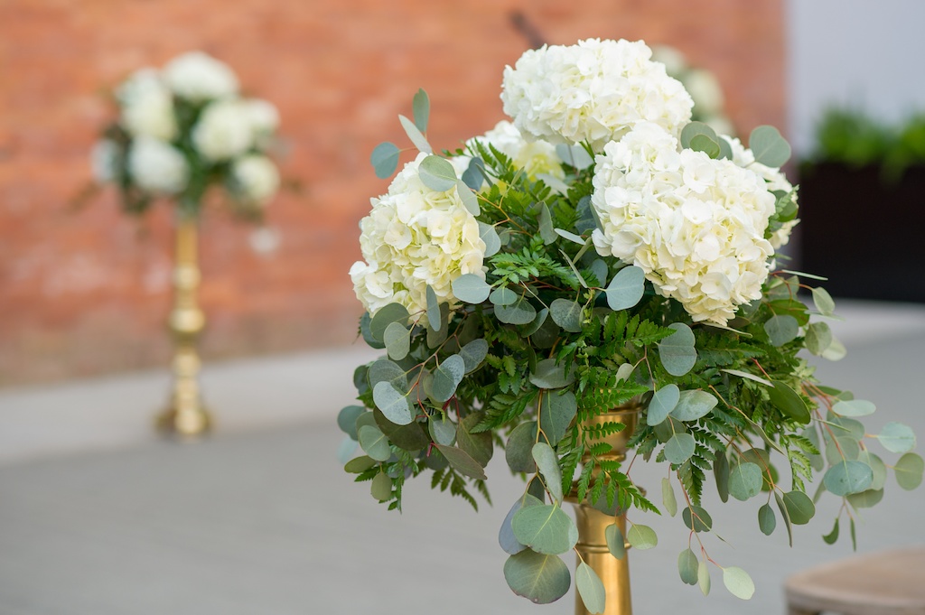 Outdoor Industrial Rustic Chic Wedding Ceremony White Hydrangea Florals with Ferns and Greenery in Tall Gold Planters