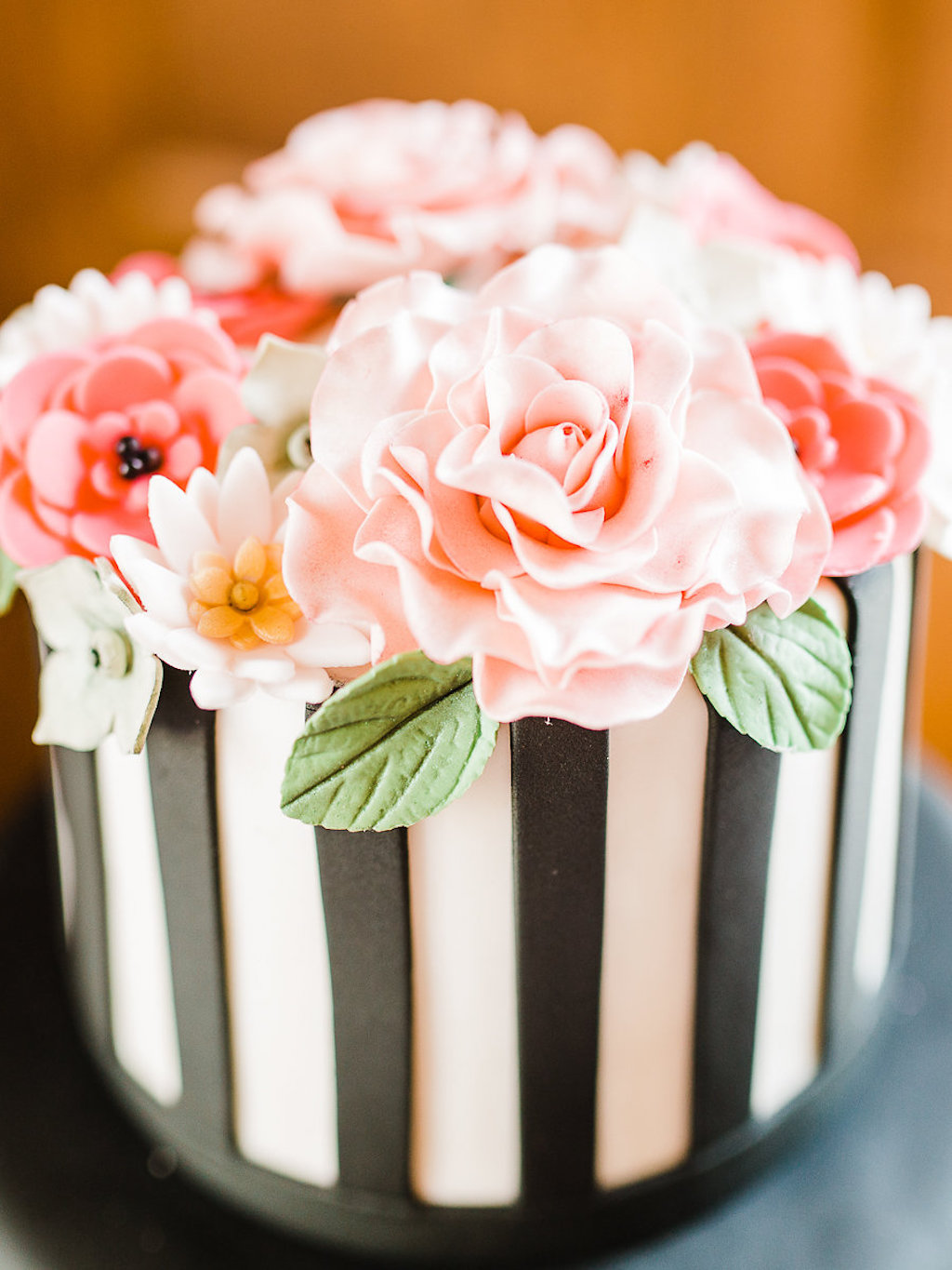 Kate Spade Inspired Round Wedding Cake with Black and White Vertical Striped Fondant, Pink Icing Flowers with Greenery