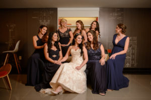 Bridal Party Getting Ready Portrait, Bride in Strapless Champagne Mermaid Wedding Dress, Bridesmaids in Mismatching Black and Dark Blue Dresses | Downtown Tampa Wedding Accommodations Le Meridien