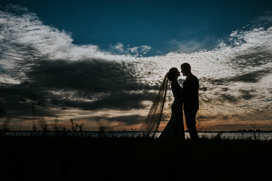 Outdoor Waterfront Sunset Creative Wedding Silhouette Portrait | Tampa Bay Wedding Photographer Brandi Image Photography