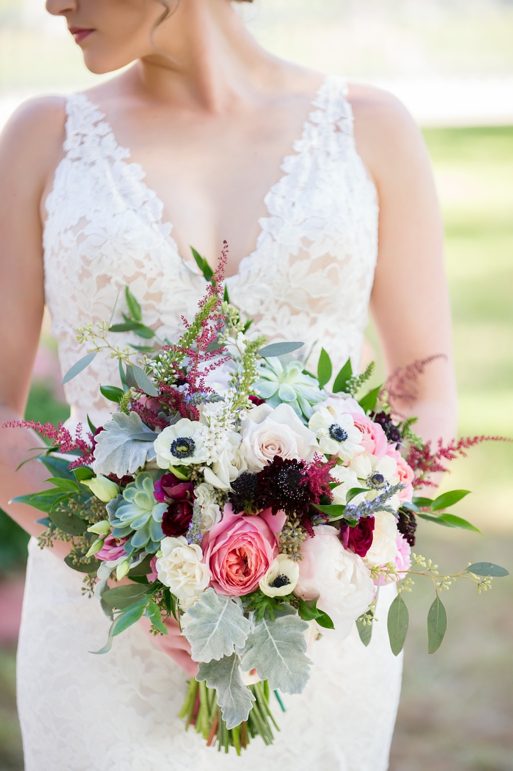 Outdoor Bridal Portrait in Illusion Lace V Neck Paloma Blanca Dress with Sage Greenery, Pink, Burgundy, Black and White Anemone Floral Bouquet | Sarasota Wedding Photographer Andi Diamond Photography