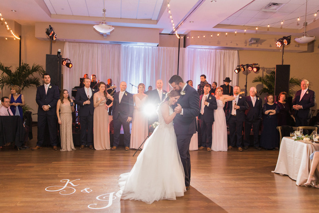 Bride and Groom First Dance Wedding Portrait, Bride in Ballgown Dress, Groom in Navy Blue and Bridesmaids in Blush Pink | Tampa Bay Wedding Venue St Pete Beach Community Center