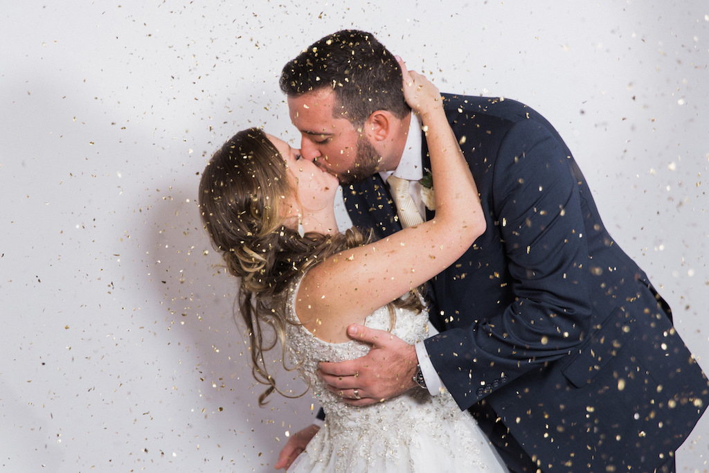 Bride and Groom Gold Confetti Kiss Wedding Portrait | Tampa Bay Wedding Planner and Designer UNIQUE Weddings + Events