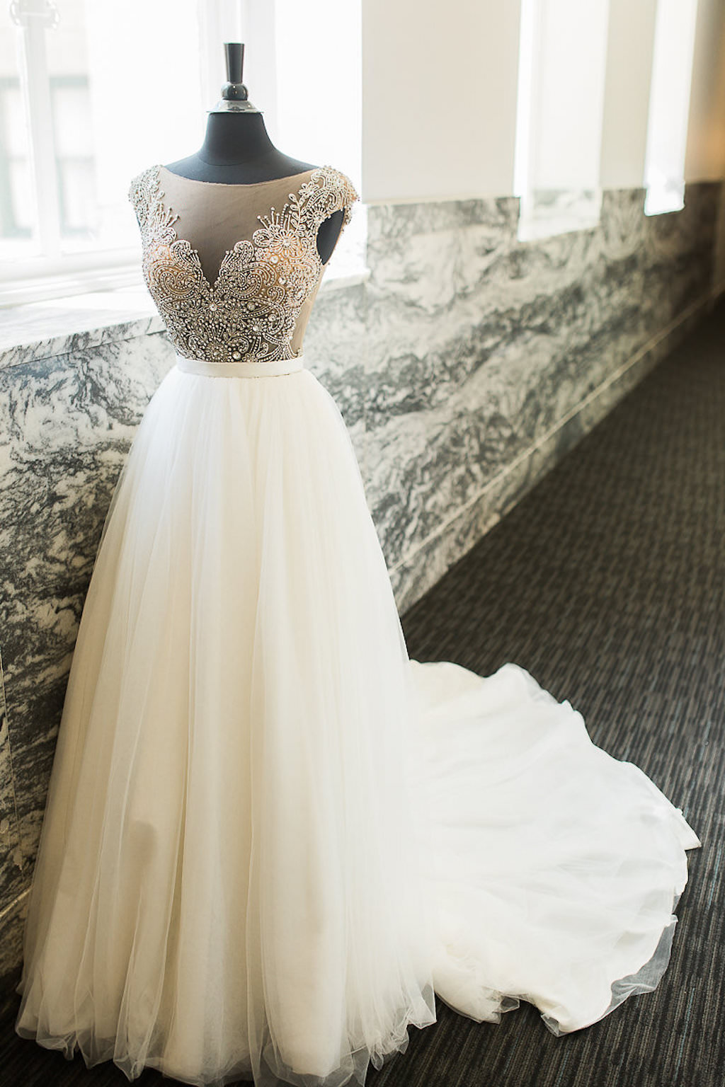 Illusion Lace Beaded Gold and Silver Bodice Wedding Dress with Full Ballgown Layered Skirt on Mannequin