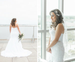Outdoor Waterfront Wedding Portrait, Bride in Strapless Belted Mermaid David's Bridal Dress, with White Floral Hair Accessory and White and Greenery Bouquet | Hotel Reception Venue The Westin Tampa Bay