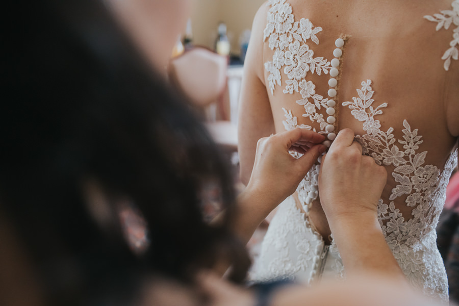 Bride Getting Ready Portrait in Illusion Lace Open Back Applique Buttoned Essence of Australia Wedding Dress | Tampa Bay Wedding Photographer Brandi Image Photography