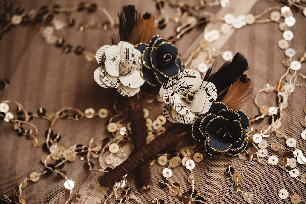 1920s Vintage Glam Inspired Wedding Paper Flower Boutonniere with Sheet Music and Black and Gold Glitter Petals and Feathers