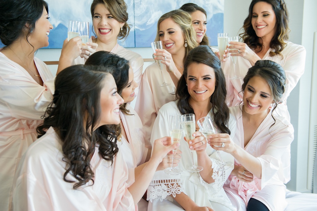 Bridal Party Getting Ready Candid Portrait in Matching Pink and White Silk Robes | Tampa Bay Wedding Photographer Andi Diamond Photography