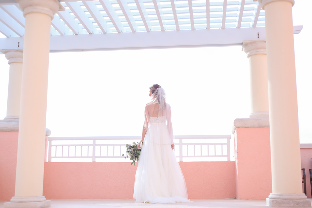 Hotel Rooftop Bridal Portrait in Strapless Wtoo Bridal Wedding Dress, with Greenery Bouquet and Comb Veil | Tampa Bay Photographer Lifelong Studios Photography | Waterfront Hotel Venue Hyatt Regency Clearwater Beach
