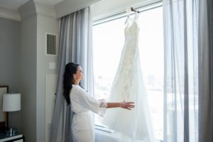 Bride Getting Ready Portrait with Illusion Lace Open Back Sweetheart A Line Wedding Dress on Flower Hanger | Tampa Bay Wedding Photographer Andi Diamond Photography