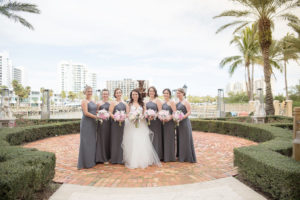 Outdoor Downtown Sarasota Park Bridal Party Portrait, Bride in Ballgown Hayley Paige Dress, Bridesmaids in Halter Gray Column Dresses with PInk Peony and Greenery Bouquets | Sarasota Wedding Photographer Kristen Marie Photography