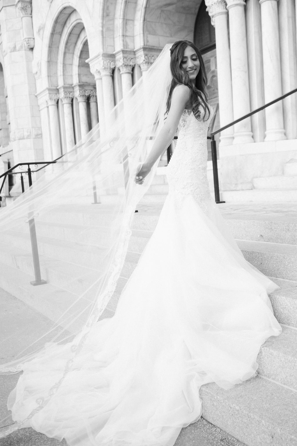 Outdoor Church Steps Bridal Portrait in Trumpet Martina Liana Dress with Long Veil