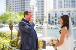 Outdoor Downtown Waterfront Father of the Bride First Look Portrait, Bride in Open Back Lace Sweetheart A Line Wedding Dress with Long Lace Edged Comb Veil and White and Pink Rose with Greenery Bouquet | Tampa Wedding Photographer Andi Diamond Photography
