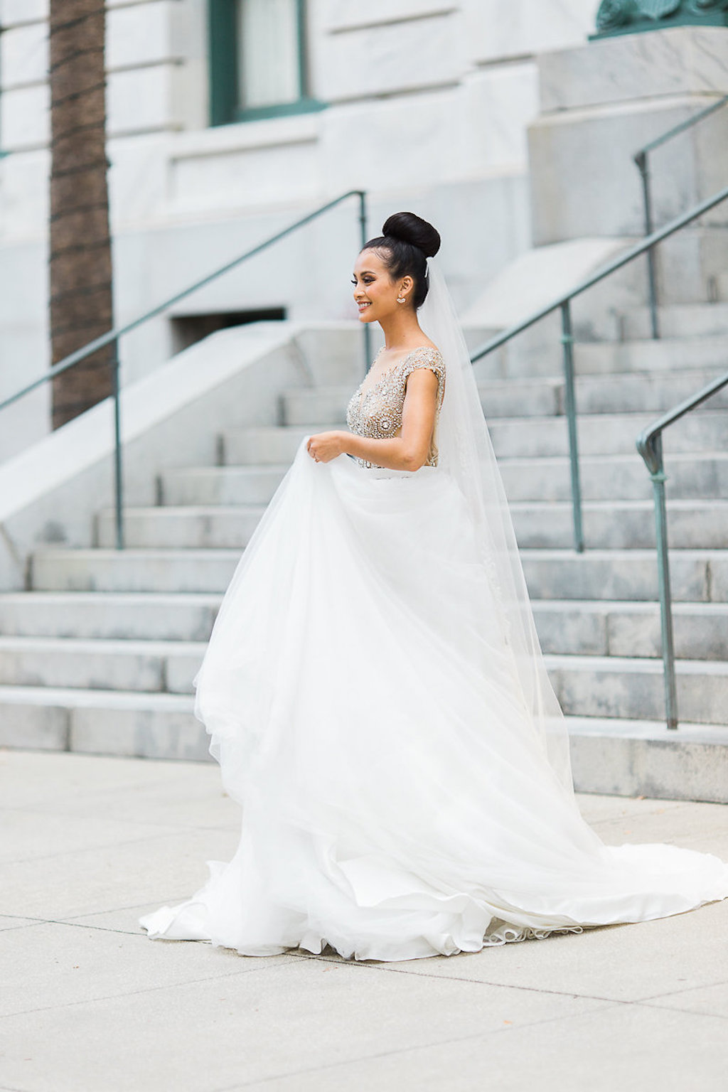 OUtdoor Bridal Portrait with Stylish Bun Updo, Long Veil, in Gold Beaded Lace Bodice Ballgown Wedding Dress