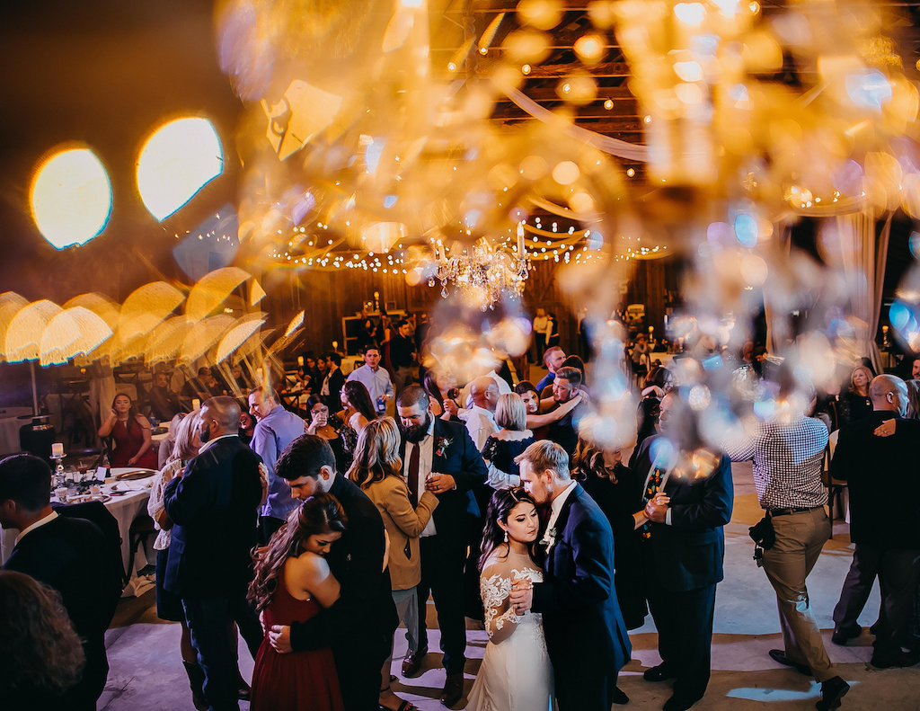 Bride and Groom Dancing at Indoor Rustic Barn Wedding Reception | Tampa Bay Wedding Photographer Rad Red Creative | Lithia Wedding Venue Southern Grace