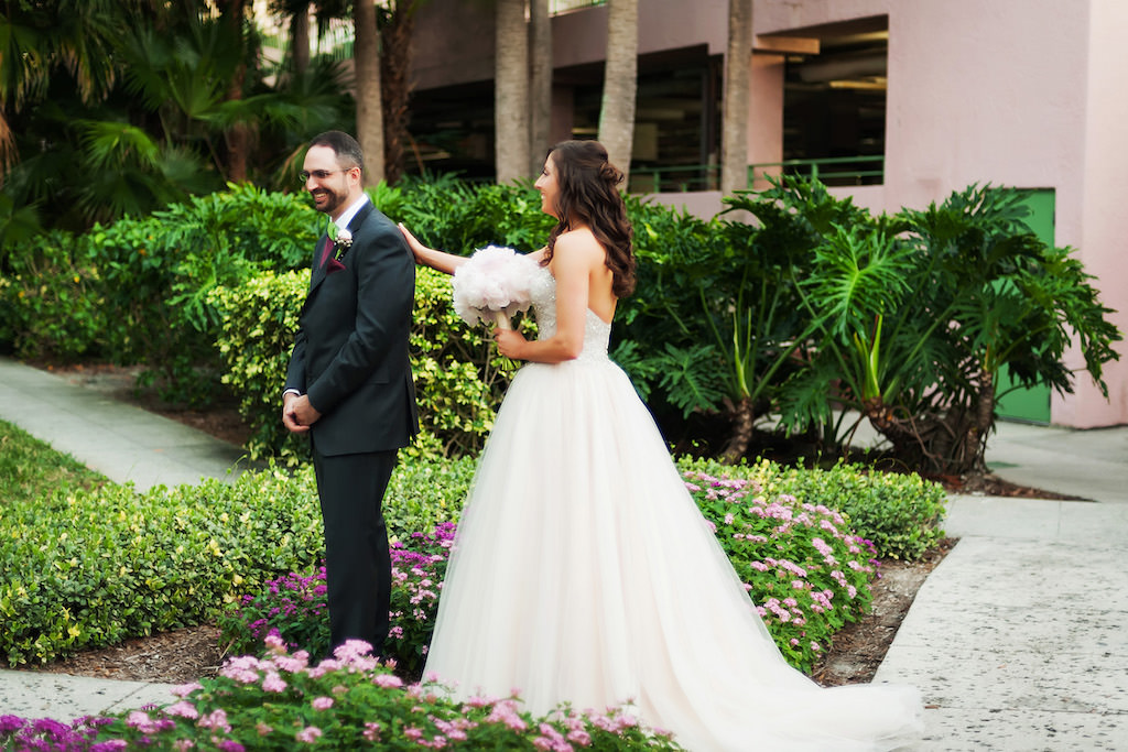 Blush Pink Sweetheart Wedding Dress with Lace and Rhinestones and Blush Pink Peonies Bouquet Bride and Groom's First Look | Tampa Bay Bridal Shop Truly Forever Bridal