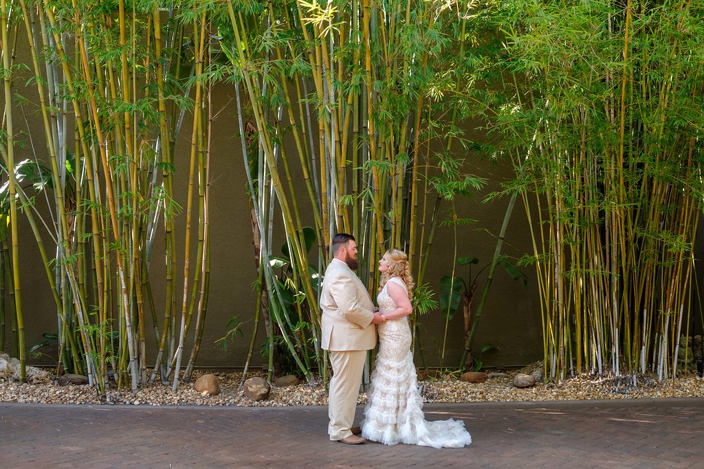 Outdoor Bride and Groom Wedding Portrait, Bride in Fit and Flare Lace and Ruffle Skirt Wedding Dress with Tank Top Straps and Plunging V-Neckline, Groom in Tan Suit | St. Pete Photographer Marc Edwards Photography | Downtown St. Pete Wedding Venue NOVA 535