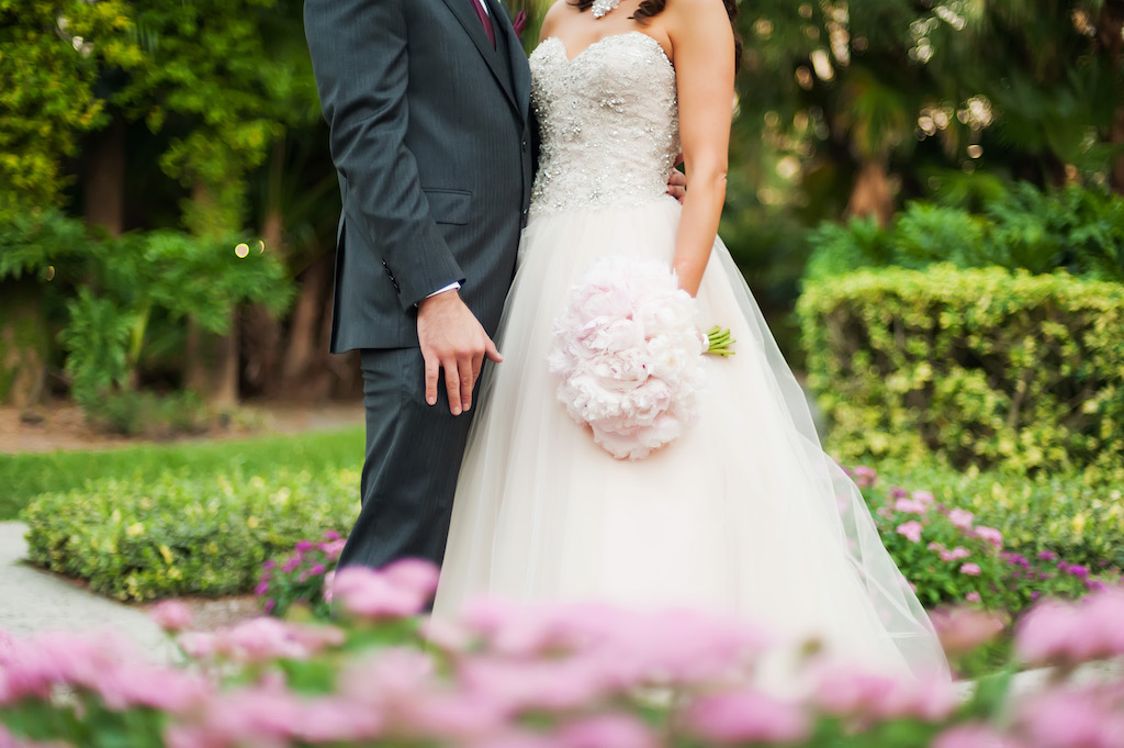 Blush Pink Sweetheart Wedding Dress with Lace and Rhinestones and Blush Pink Peonies Bouquet Bride and Groom Half Body Portrait| Tampa Bay Bridal Shop Truly Forever Bridal