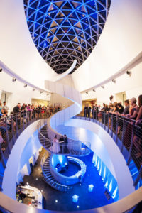Salvador Dali Museum Ceremony Spiral White Staircase with Blue Uplighting and Bride and Groom Exchanging Vows with Guests Overlooking Balcony