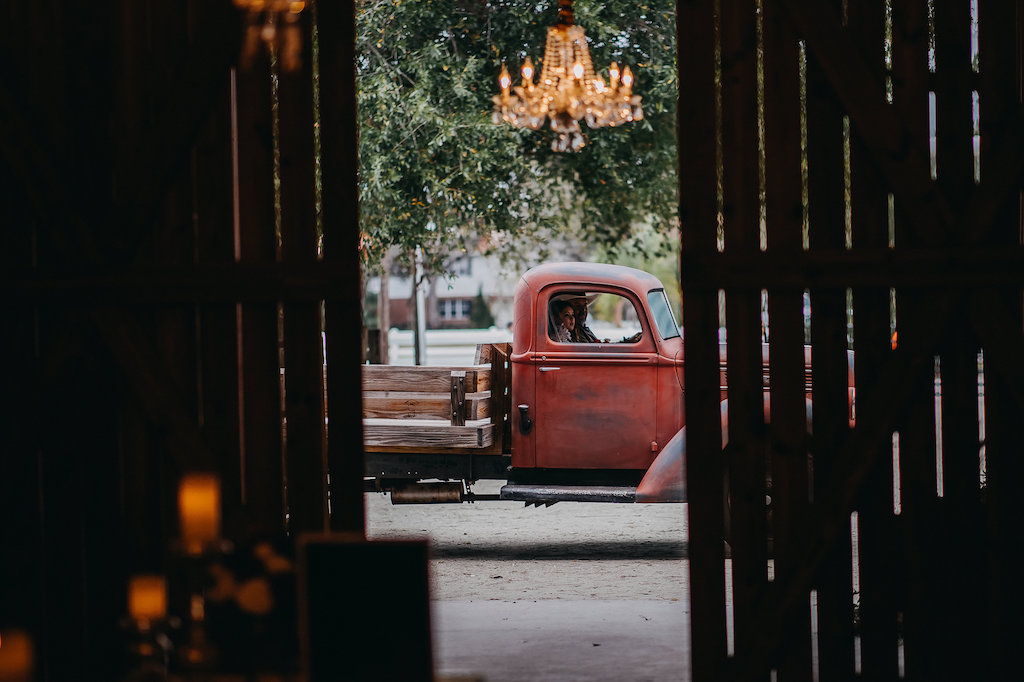 Barn Wedding Reception with Crystal Chandelier and Red Vintage Pickup Truck | Tampa Bay Wedding Photographer Rad Red Creative | Lithia Rustic Wedding Venue Southern Grace