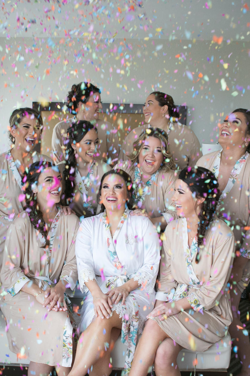 Bridal Party Getting Ready Wedding Portrait with Confetti Toss in Matching Mauve Silk Robes | Tampa Bay Wedding Photographer Carrie Wildes Photography