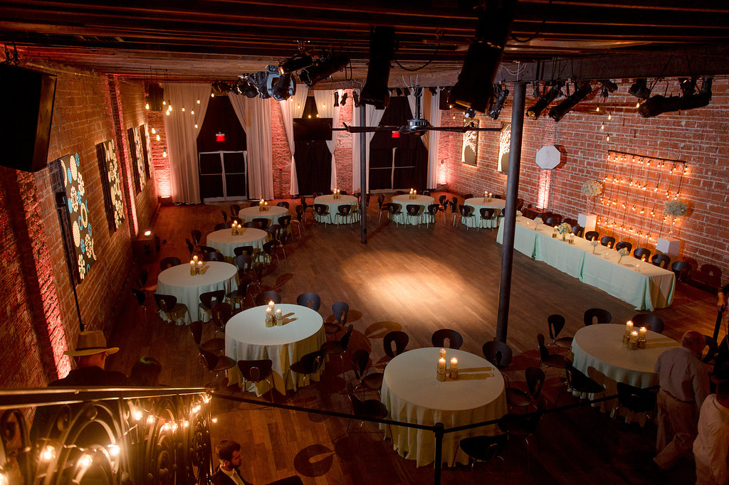 Indoor Wedding Reception Decor, Round Tables with White Linens, Candlestick Centerpieces | Downtown St Pete Unique Wedding Reception Venue NOVA 535 | Tampa Photographer Marc Edwards Photography